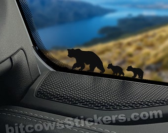 May include: Black silhouette decal of a mama bear and two cubs walking, with the text "bitcowsstickers.com" and "Approximate Size 3" in the bottom right corner.