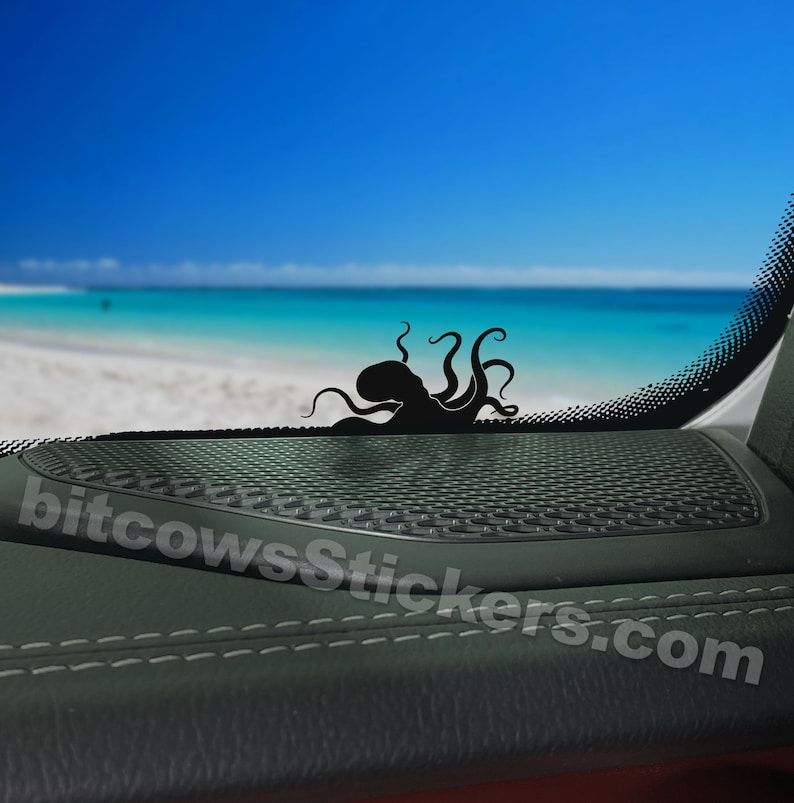 May include: Black octopus silhouette sticker on a car window with a beach scene in the background. The sticker is placed on a black speaker grille. The text "bitcowsstickers.com" is visible in the lower right corner.