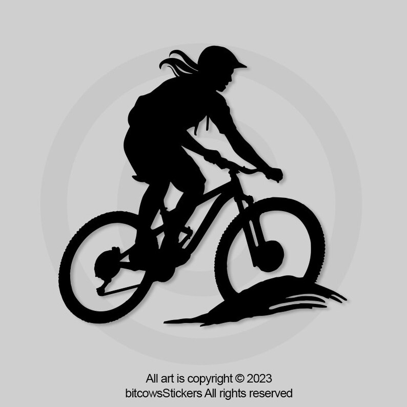 May include: Silhouette of a person riding a mountain bike on a dirt trail. The person is wearing a helmet and has long hair. The bike has two wheels and a suspension fork.