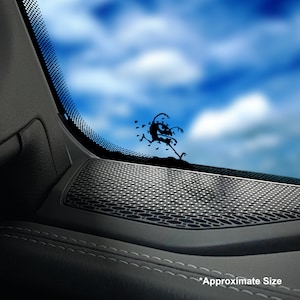 May include: A black vinyl decal of a cartoon monster running across a surface, with a blue sky background. The decal is affixed to a car window. The text "Approximate Size" is at the bottom.
