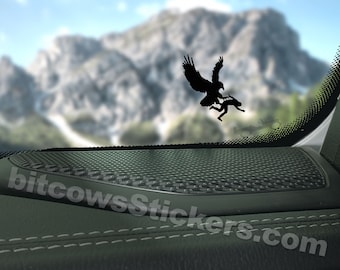 May include: Black silhouette decal of an eagle carrying a person in its talons. The decal is placed on the inside of a car window, with a mountain range visible in the background. The text "bitcowsStickers.com" is visible in the lower right corner of the image. The text "*Jeep not include" is visible in the lower right corner of the image.