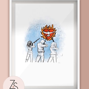 May include: Framed art print featuring a stylized illustration. Three figures aim rifles at a flaming heart pierced by a ribbon. The heart is red and orange, set against a blue and white background. The print is in a white frame, with the artist's logo in the lower left corner.