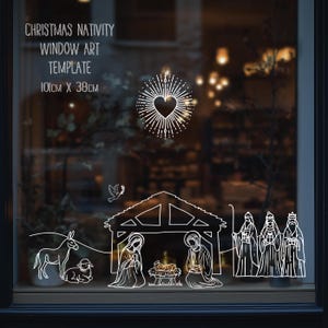 Puede incluir: Plantilla de arte para ventana blanca con el texto "CHRISTMAS NATIVITY WINDOW ART TEMPLATE 101cm X 38cm". El diseño presenta una explosión en forma de corazón, una paloma, un pesebre y los tres reyes magos.