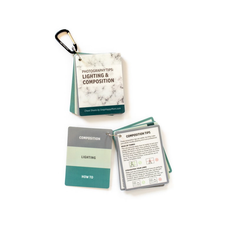 May include: A set of photography cheat sheets with a green, white, and gray color scheme. The cheat sheets are organized into three sections: Composition, Lighting, and How To. The cheat sheets are attached together with a metal ring.