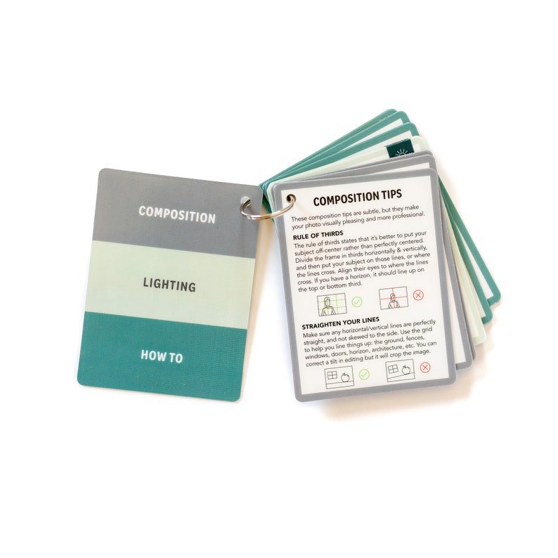 May include: A set of teal and gray cards with tips on photography composition. The cards feature the text "Composition", "Lighting", "How To", "Rule of Thirds", and "Straighten Your Lines".