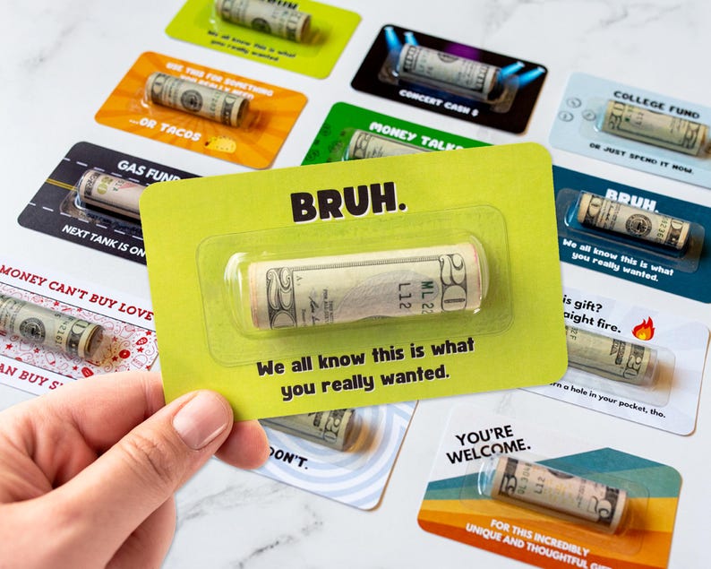 May include: Various funny money gift cards featuring rolled-up cash inside clear plastic sleeves. Cards have phrases like 'Bruh', 'Gas Fund', 'Concert Cash', and 'College Fund'. The cards are bright, colorful, and playful, ideal for a unique and humorous gift-giving experience. Each card includes a witty message along with the cash.