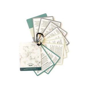 May include: A set of green and white cards with a marble-patterned card on top. The cards have text on them and are held together by a black carabiner clip. The text on the marble card reads "snap happy mom".