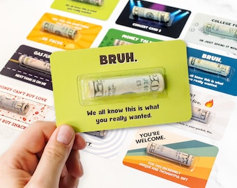 May include: A lime green rectangular gift card featuring a clear plastic blister pack containing a rolled twenty-dollar bill. The card displays the text BRUH. and We all know this is what you really wanted. in black sans-serif font.