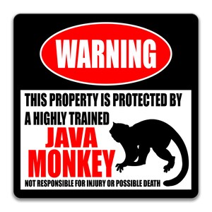 May include: A black and white warning sign with red text that reads "WARNING". The sign says "This property is protected by a highly trained JAVA MONKEY. Not responsible for injury or possible death." The sign also features a silhouette of a monkey.