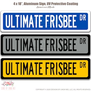 May include: A 4 x 18 inch aluminum sign with the text "ULTIMATE FRISBEE DR" in white letters on a blue background. The sign is available in three color variations: blue, gray, and yellow.