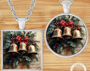 May include: Two silver pendant necklaces. One square and one round, each featuring a Christmas design. The designs include three golden bells, red bows, holly, and musical notes. The pendants hang from silver chains.