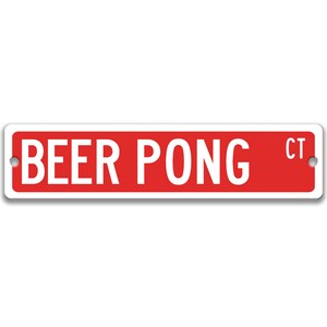 以下が含まれることがあります： 白文字で「BEER PONG CT」と書かれた赤と白の金属製の看板です。