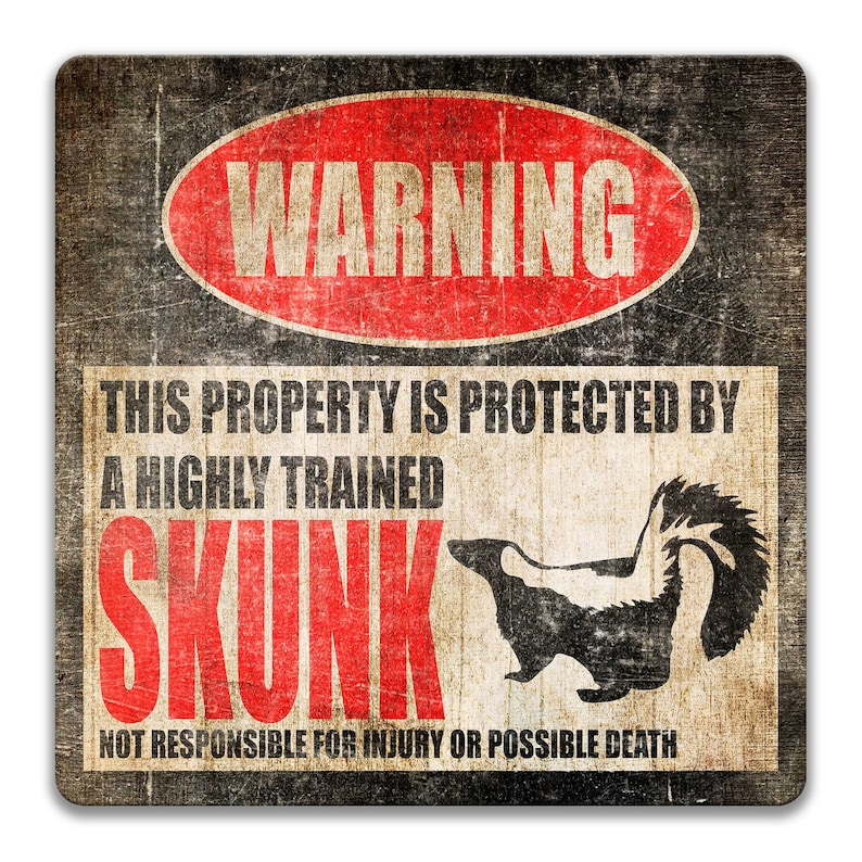 May include: A warning sign with a distressed, vintage look. It features a red oval with the word "WARNING" in white text. The sign reads "This property is protected by a highly trained skunk. Not responsible for injury or possible death." A black and white illustration of a skunk is included.