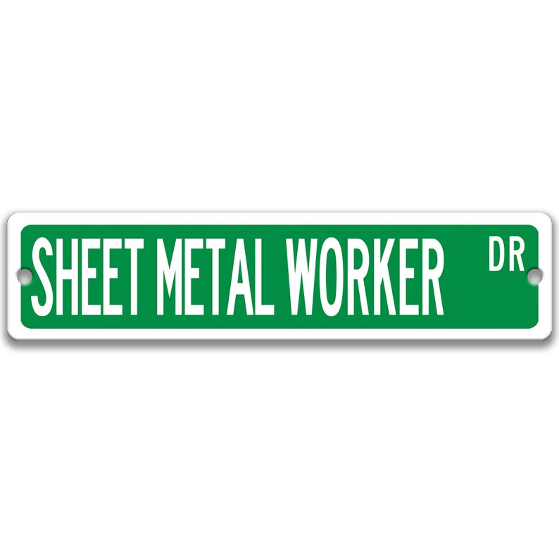 May include: A rectangular green and white street sign that reads "SHEET METAL WORKER DR". The sign has a white border and two holes for mounting. The text is in a bold, sans-serif font.
