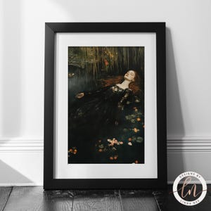May include: A woman in a black dress lies in a pool of water with pink and white flowers. The water is dark and murky, and the woman's hair is long and flowing. The image is a dark and moody portrait.