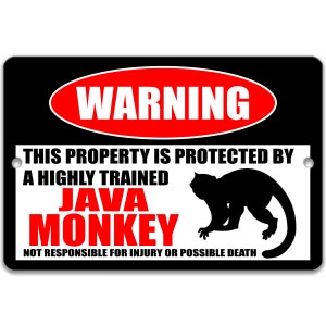 May include: A black and white warning sign with red text that reads "WARNING" in a circle. The sign says "This property is protected by a highly trained JAVA MONKEY. Not responsible for injury or possible death."  A black silhouette of a monkey is in the bottom right corner.