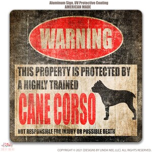 May include: A red warning sign with the text "WARNING" in a white circle. The sign reads "This property is protected by a highly trained Cane Corso. Not responsible for injury or possible death." The sign has a distressed, vintage look and features a black silhouette of a Cane Corso dog.