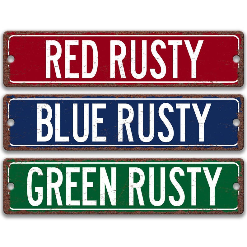 three signs with the text "RED RUSTY BLUE RUSTY GREEN RUSTY" written on them.