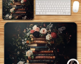 May include: A rectangular mouse pad and a square coaster feature a floral design with a stack of books and roses in shades of pink, red, and white. A white keyboard and mouse are also present. The design is set against a dark background.