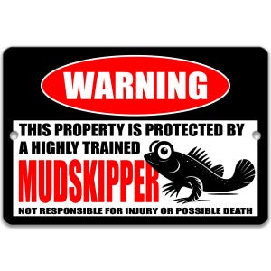 May include: Black rectangular sign with a red and white "WARNING" banner. The sign reads "THIS PROPERTY IS PROTECTED BY A HIGHLY TRAINED MUDSKIPPER. NOT RESPONSIBLE FOR INJURY OR POSSIBLE DEATH." A black mudskipper graphic is on the right.