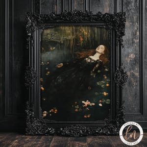 May include: A framed print of a woman in a black dress lying in a pool of water with flowers. The woman has long red hair and is wearing a black lace dress. The print is framed in a black ornate frame.