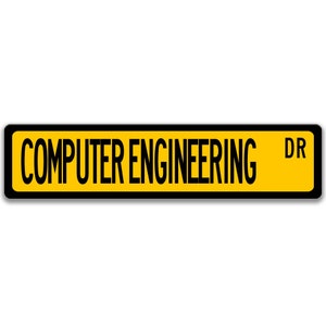 May include: A yellow street sign with black text and a black border. The sign reads "COMPUTER ENGINEERING DR".