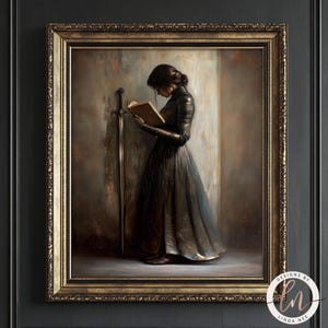 May include: A framed painting shows a person reading a book, with a sword against a wall. The person wears a dark dress. The painting has a gold frame and a dark background. The artwork is signed in the bottom right corner.