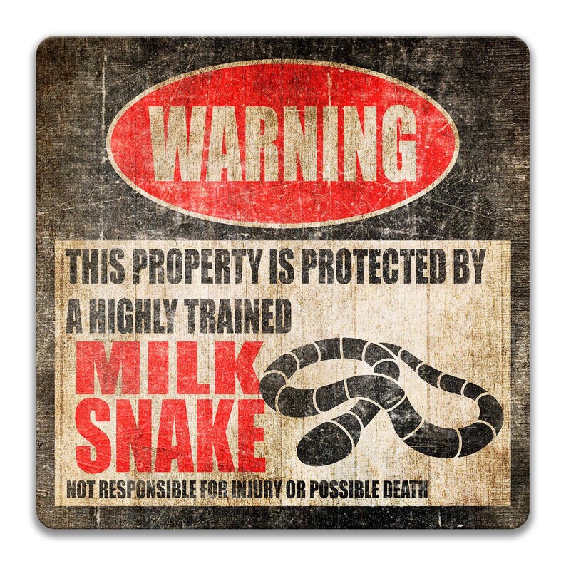 May include: A warning sign with a red circle and the word "WARNING" in white letters. The sign reads "This property is protected by a highly trained milk snake. Not responsible for injury or possible death." The sign has a distressed, vintage look.