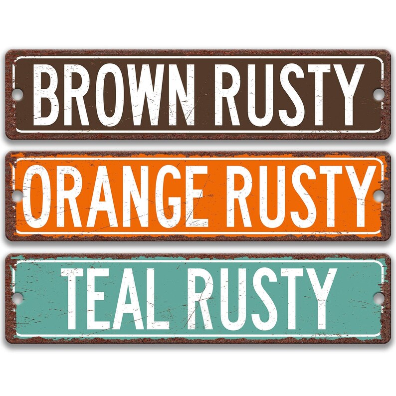 three weathered metal street signs with the names of different colors: brown, orange, and teal.