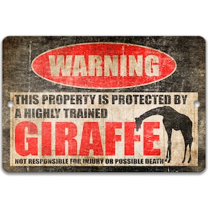 May include: A warning sign with a red circle and the word "WARNING" in white. The sign says "This property is protected by a highly trained giraffe. Not responsible for injury or possible death." The sign has a distressed, vintage look.