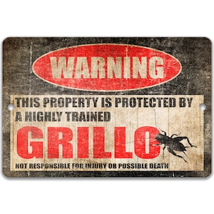 May include: A rectangular metal sign with a distressed finish. The sign features the word "WARNING" in a red oval, and text stating "THIS PROPERTY IS PROTECTED BY A HIGHLY TRAINED GRILLO". A black cricket illustration is on the right.