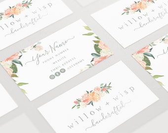 May include: A set of four business cards with a floral design and the text "willow + wisp handerafted". The cards are white with a gray floral design and text.