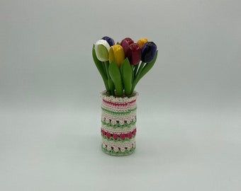 Crocheted tulip pot with wooden tulips. A wonderful gift for a birthday. Or just for fun.