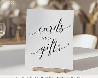 May include: White card with black calligraphy that reads "cards and gifts".