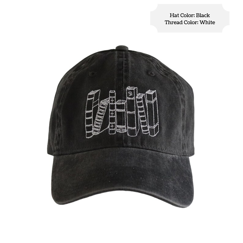 May include: A black baseball cap with a white embroidered design of a stack of books.