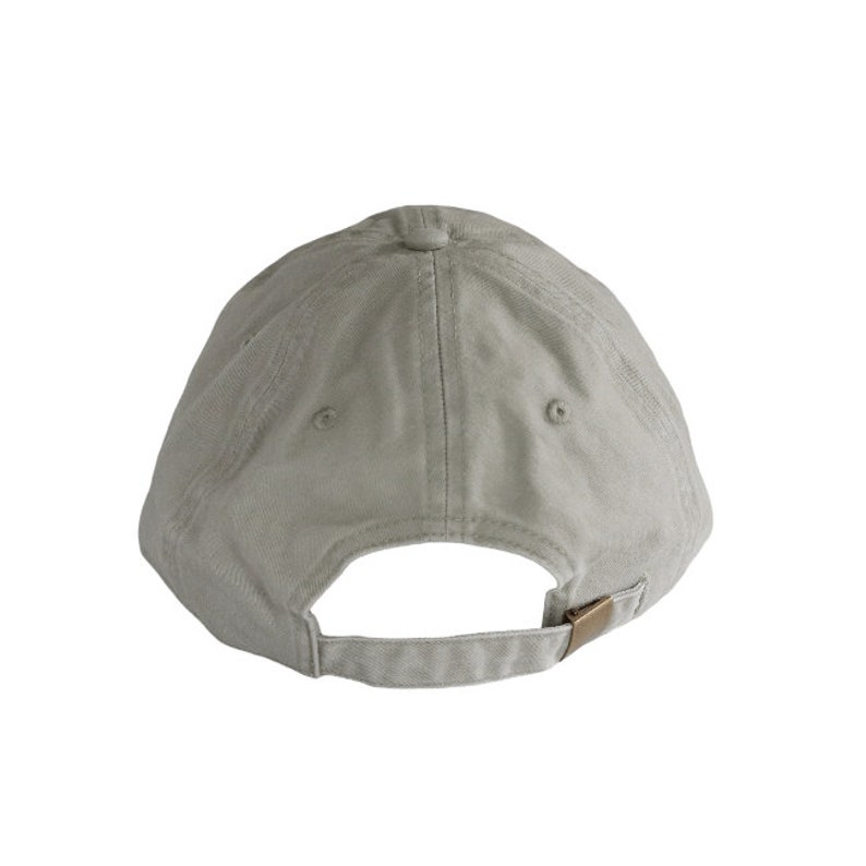 May include: A plain, light grey baseball cap with a brown adjustable strap.