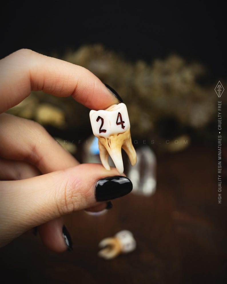 Handcrafted D6 dice shaped like a realistic human molar tooth with aged bone texture and dark gothic numbers.