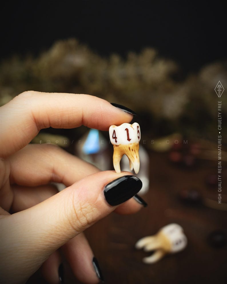 Handcrafted D6 dice shaped like a realistic human molar tooth with aged bone texture and dark gothic numbers