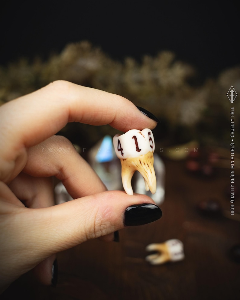 Handcrafted D6 dice shaped like a realistic human molar tooth with aged bone texture and dark gothic numbers