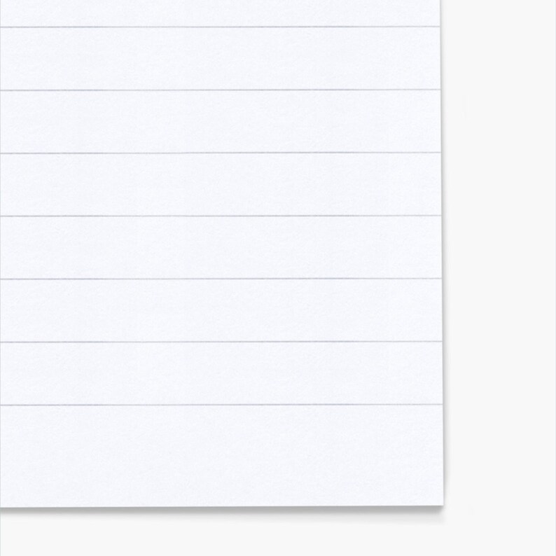 May include: A close-up of a white, textured surface with horizontal lines. The lines are evenly spaced and create a subtle pattern. The surface is clean and appears to be made of paper or a similar material.