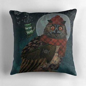 May include: Square decorative pillow featuring an owl illustration. The owl wears a red hat and scarf, with a mug of tea and a full moon in the background. The pillow has a dark teal background with a whimsical design.