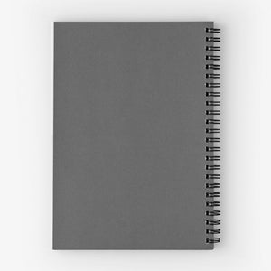 May include: A gray spiral-bound notebook with a solid cover. The notebook has a matte finish and a black spiral binding along the spine. The pages are not visible.