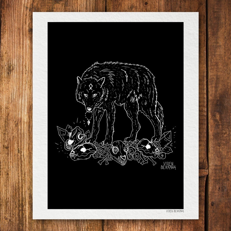 May include: A black and white line art print of a wolf standing on a pile of bones. The wolf has a symbol on its forehead and is looking down at the bones. The print is signed "Vixen Bergman" in the bottom right corner.
