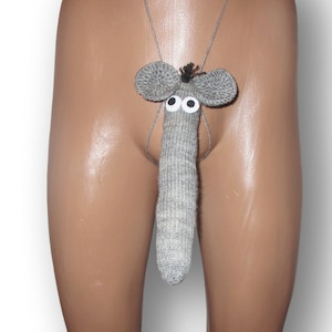 May include: A novelty gray knitted penis warmer with a mouse face design. The mouse has large gray ears, googly eyes, and a small tuft of black yarn. The warmer is attached to a thin gray string.