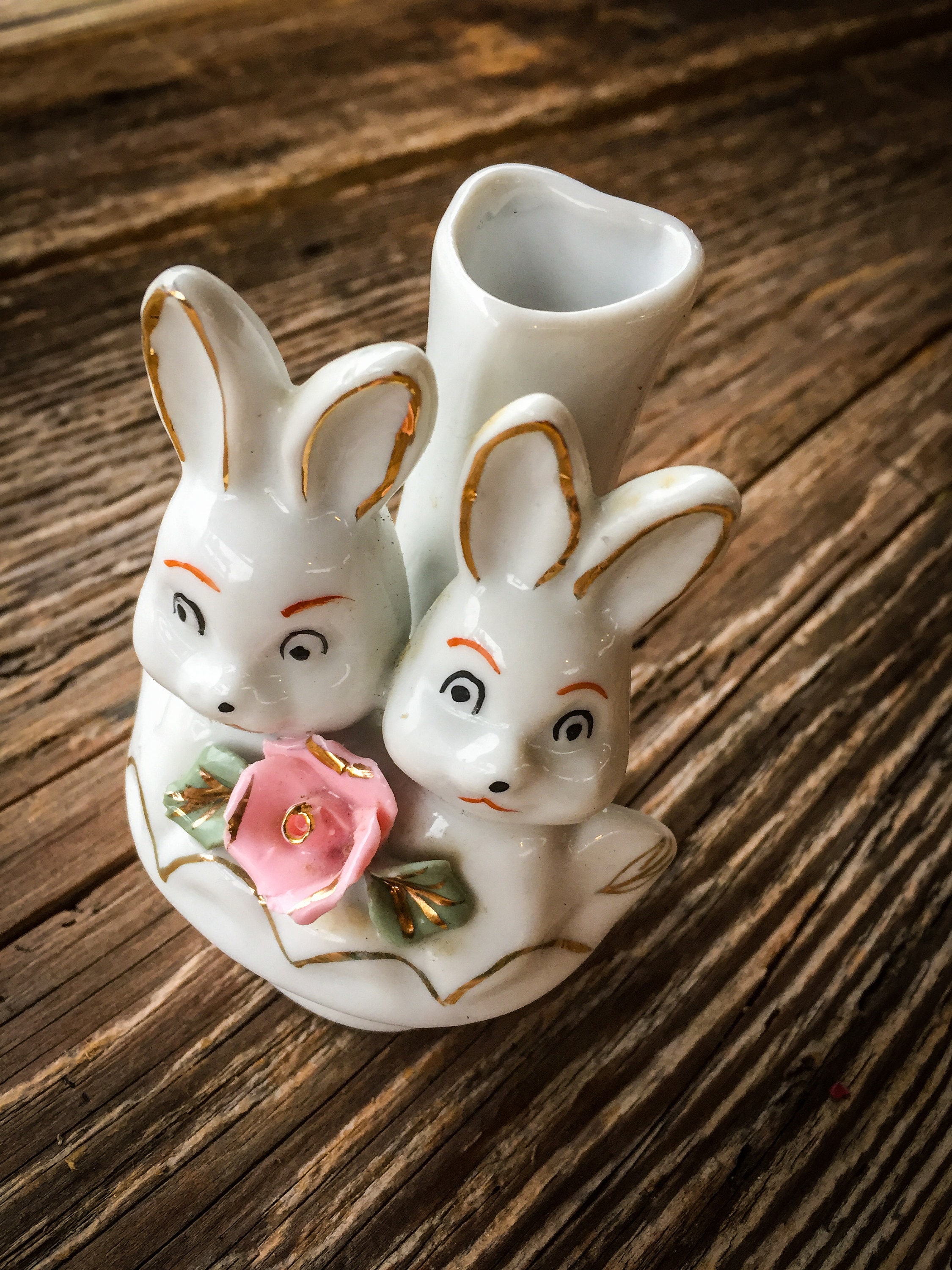 A Small Ceramic Vase With Two Rabbit Etsy