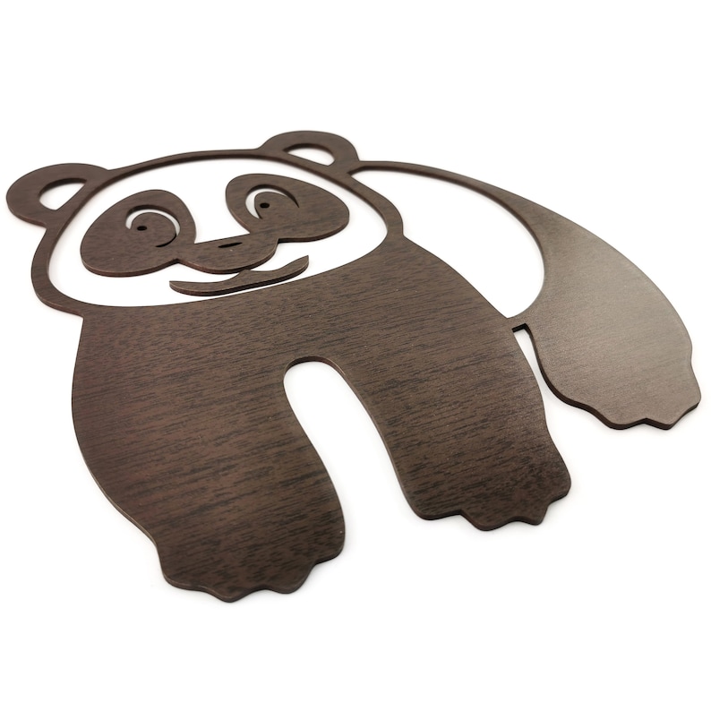 Wall art pandas - The figure of a walking panda is laser cut and made of wood.