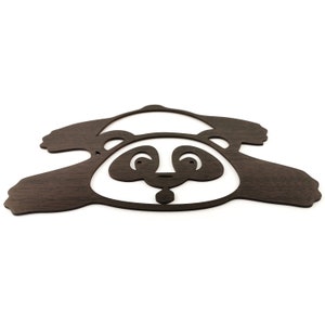Wall art pandas - a fallen panda figure is laser cut and made of wood.