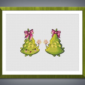 May include: Two green Christmas trees with pink bows and happy faces holding sparklers. The trees are on a white background.