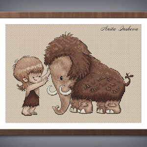 May include: A cross-stitch pattern featuring a cartoon of a young person with brown hair wearing a brown loincloth and a woolly mammoth. The mammoth is brown and has large tusks. The background is a light beige colour. The text "Anita Isheva" is in the top right corner of the image.