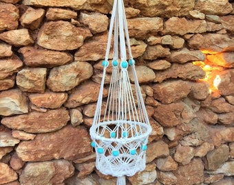 Bohemian macrame plant hanger with wooden beads.